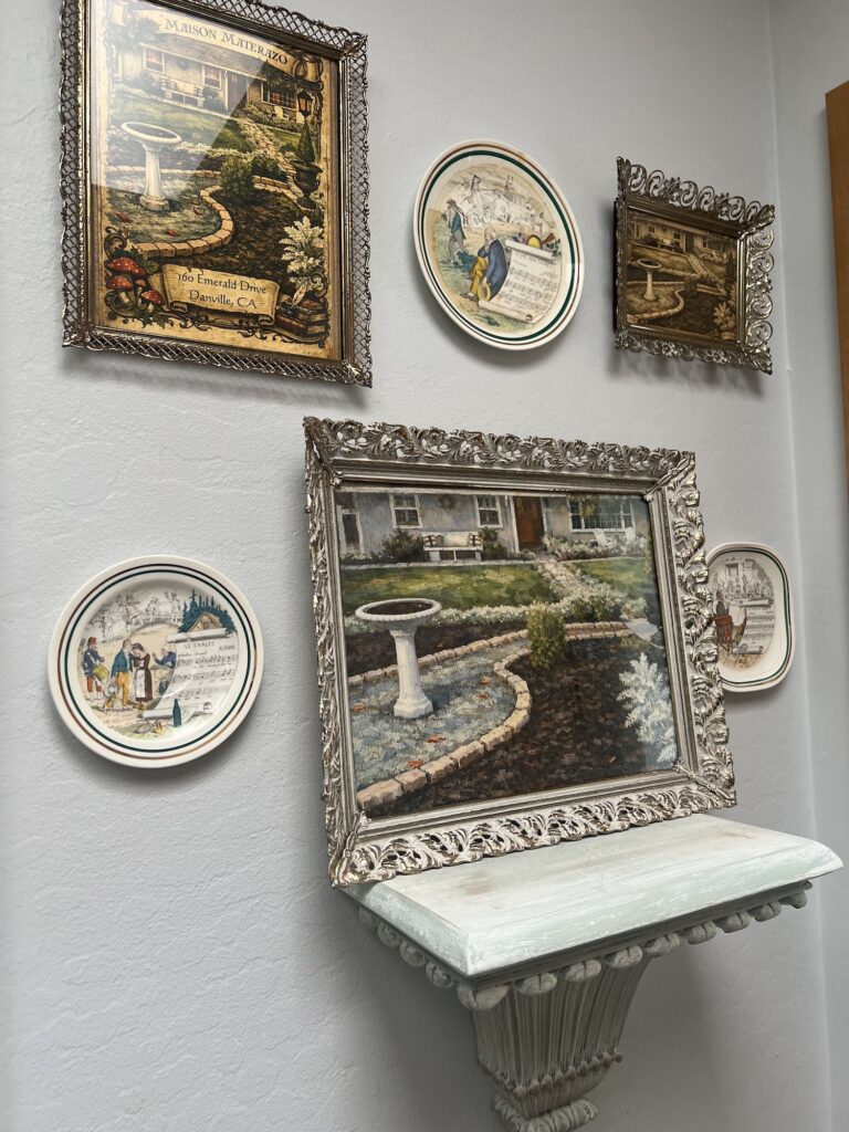 how to curate a gallery wall with thrifted collections full wall angled
