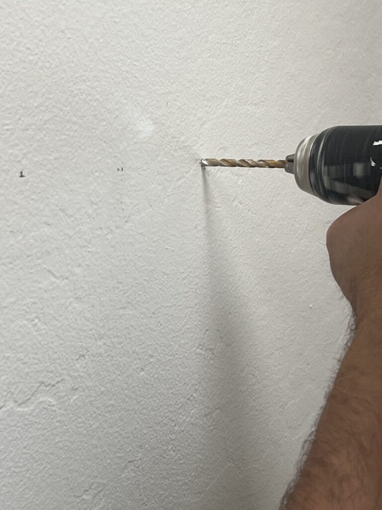 how to curate a gallery wall with thrifted collections drilling