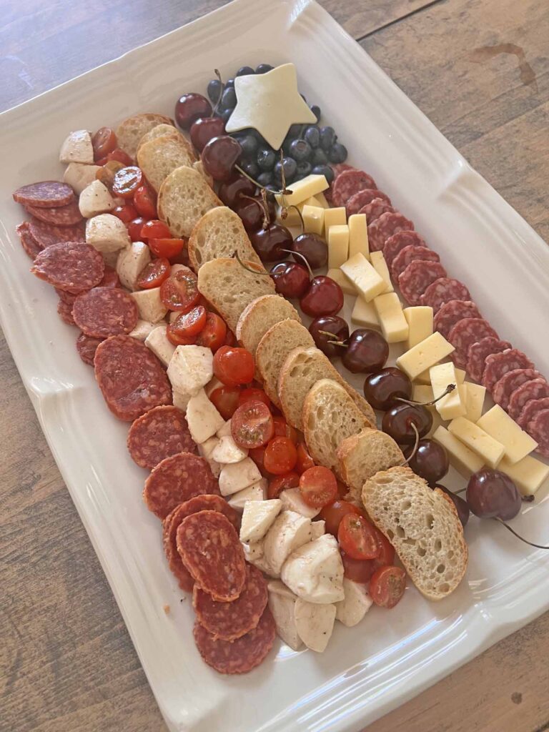 American flag charcuterie board recipe full platter on wooden kitchen table