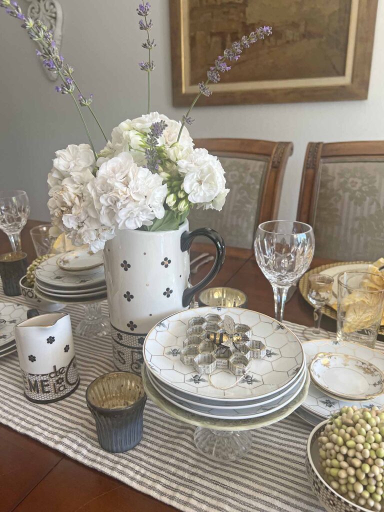 The bee's knees table setting center of table with flowers Anthro bistro tile and WS honeycomb