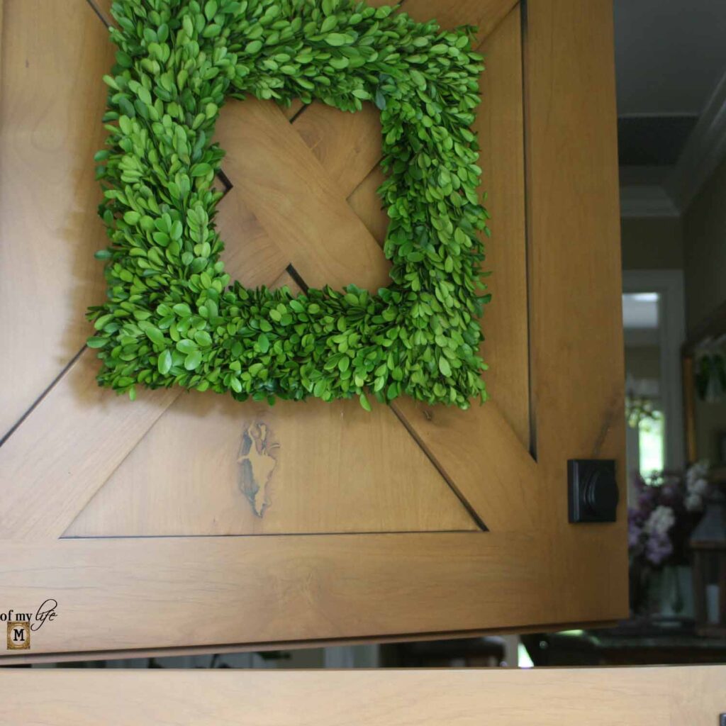 Dutch door with square boxwood wreath