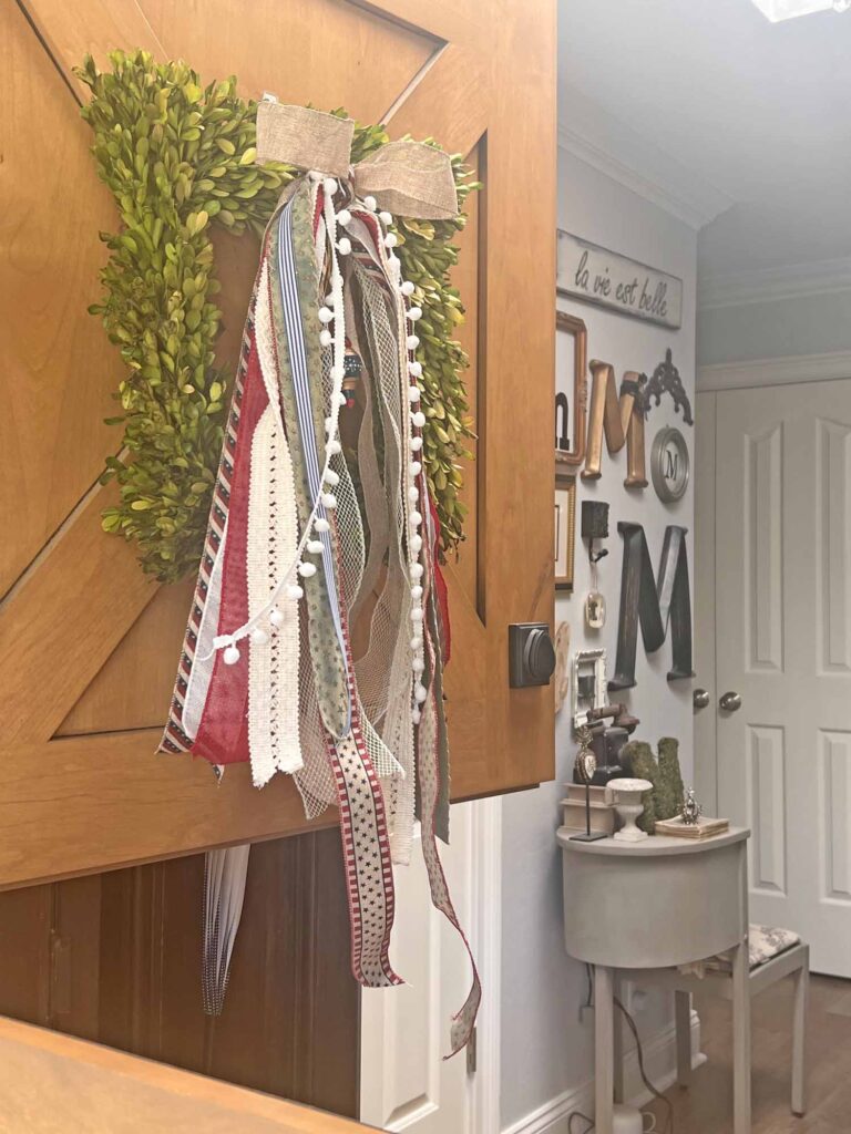 Patriotic decor: Charming, long-tailed bow for the 4th of July open dutch door with monogram wall