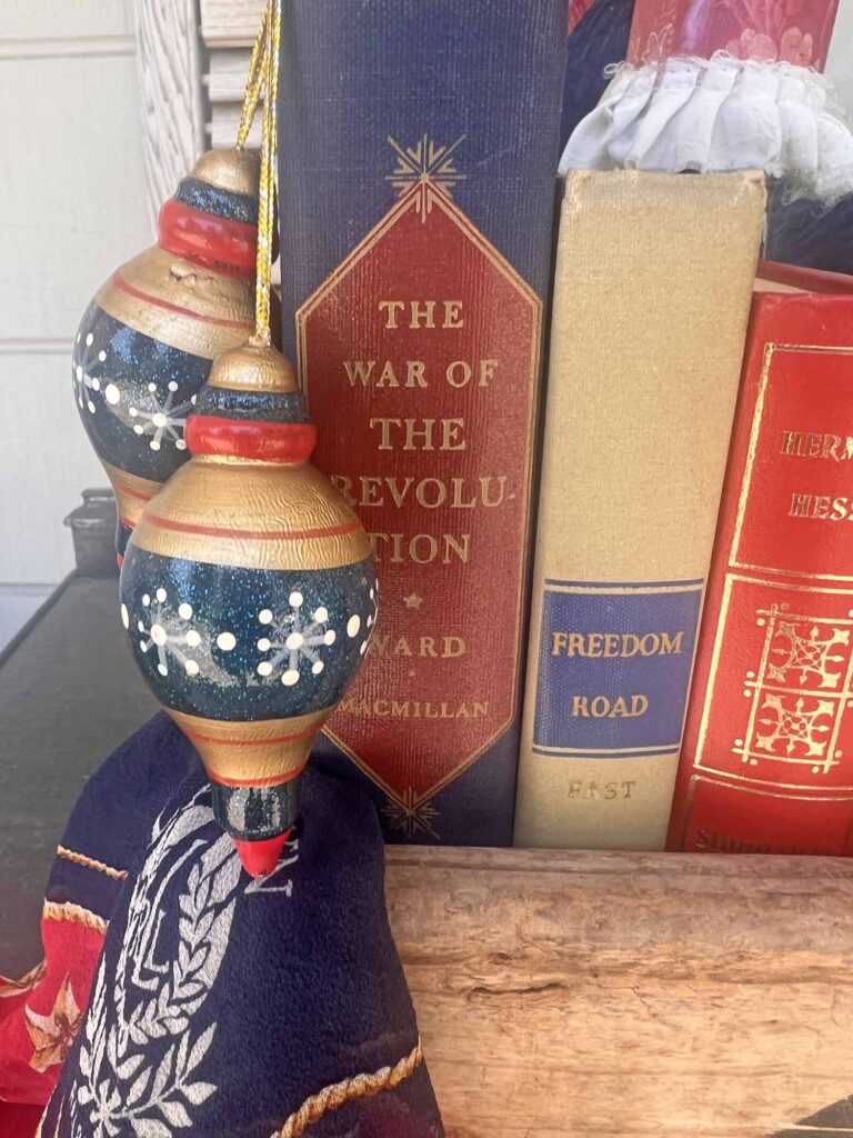 Thrift Chic Decor: Budget friendly way to decorate for the 4th of July staged styling close-up ornaments books