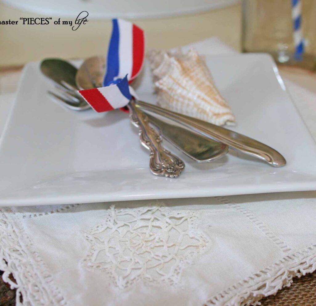 American tablescape with red white & blue ribbon and coke paraphanalia
