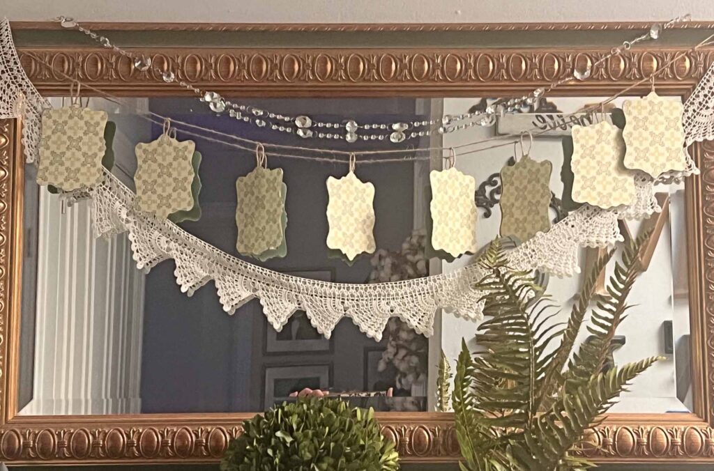 botanical summer decor vignette in the foyer with reversible garland - backside
