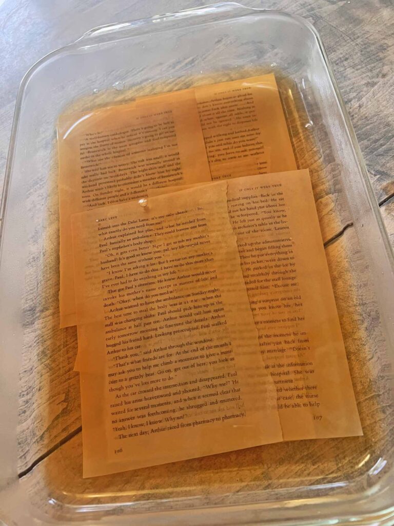 Summer craft: Botanical pressed flower garland DIY antiquing book pages in steeped tea