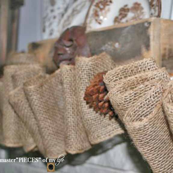 burlap and pinecone garland DIY on a mantel shelf