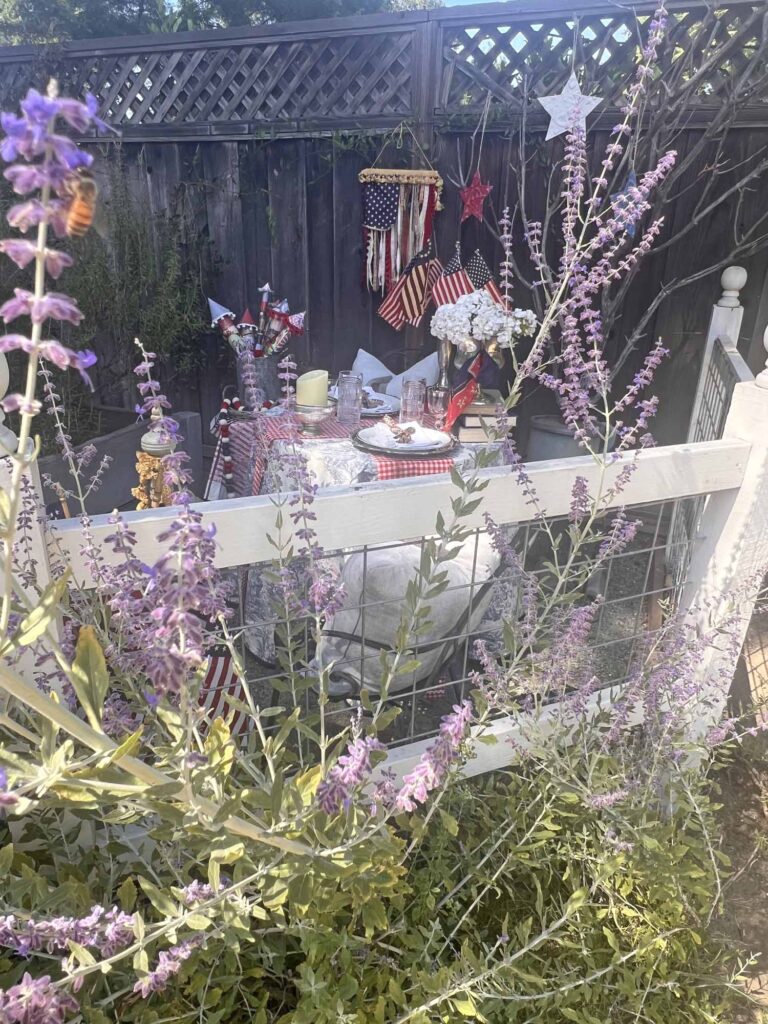 when Ralph Lauren meets French country on a Patriotic garden table on the outside of the fence looking in