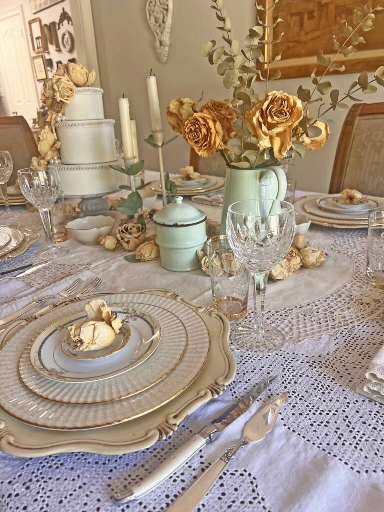 Stop & smell the roses summer tablescape angled from back of dining room towards foyer