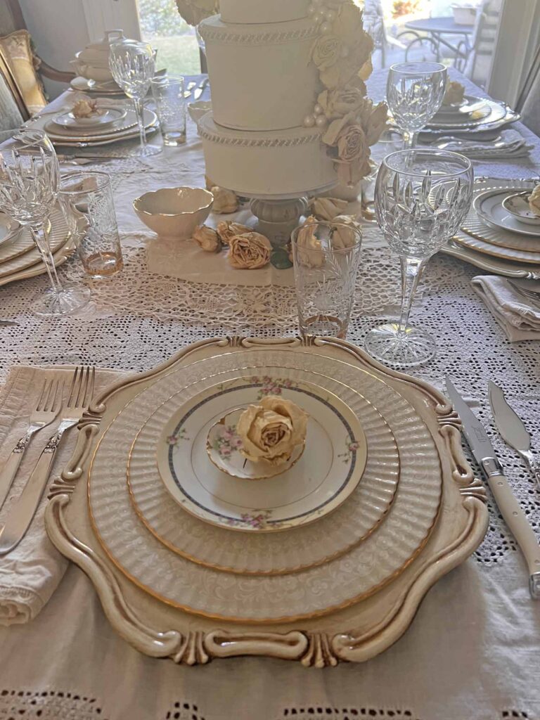 Stop & smell the roses summer tablescape table looking towards outside