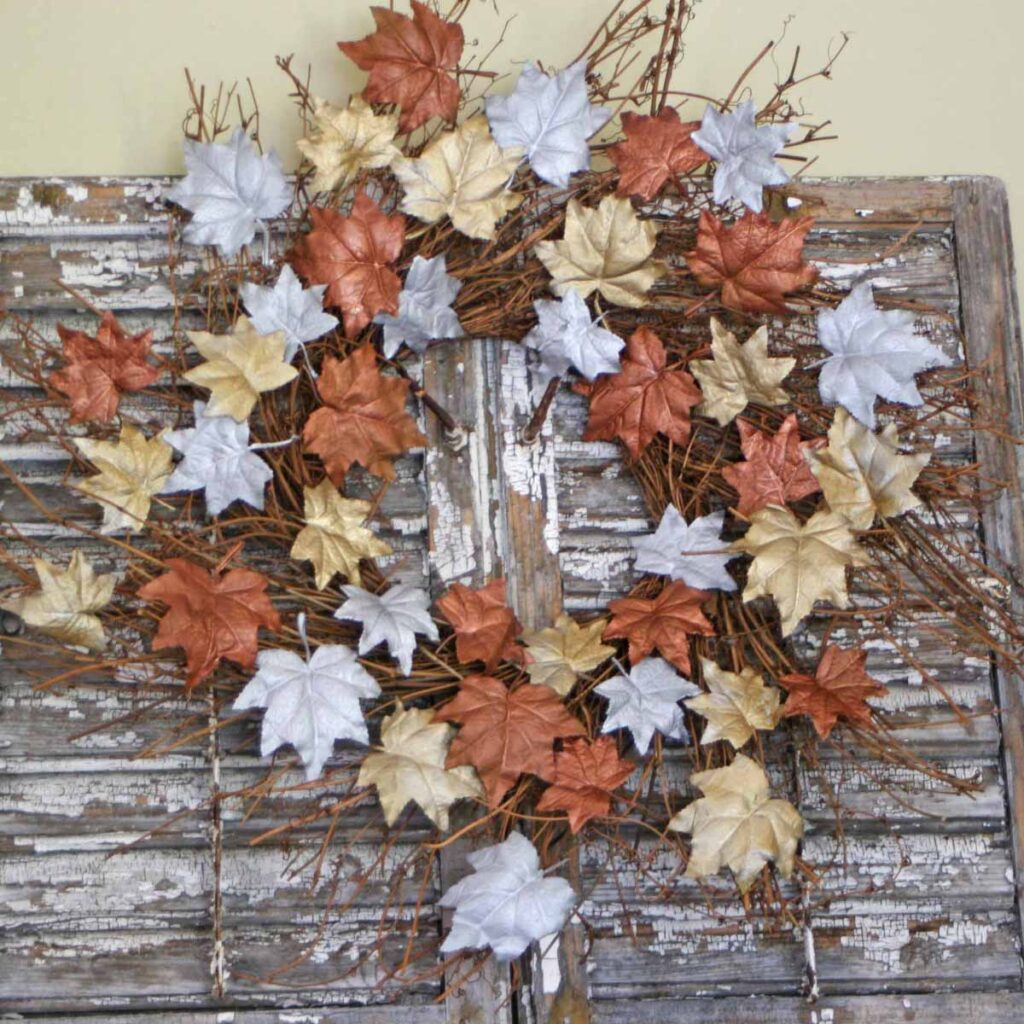 Autumnal metal leaf wreath DIY hanging on vintage shutters
