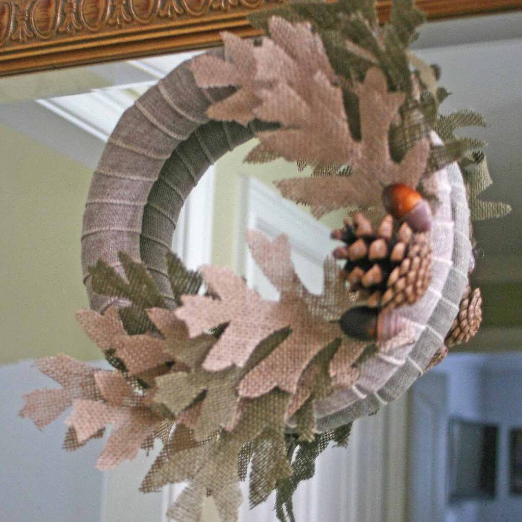 Burlap leaf and pine cone mini wreath DIY hanging on foyer mirror