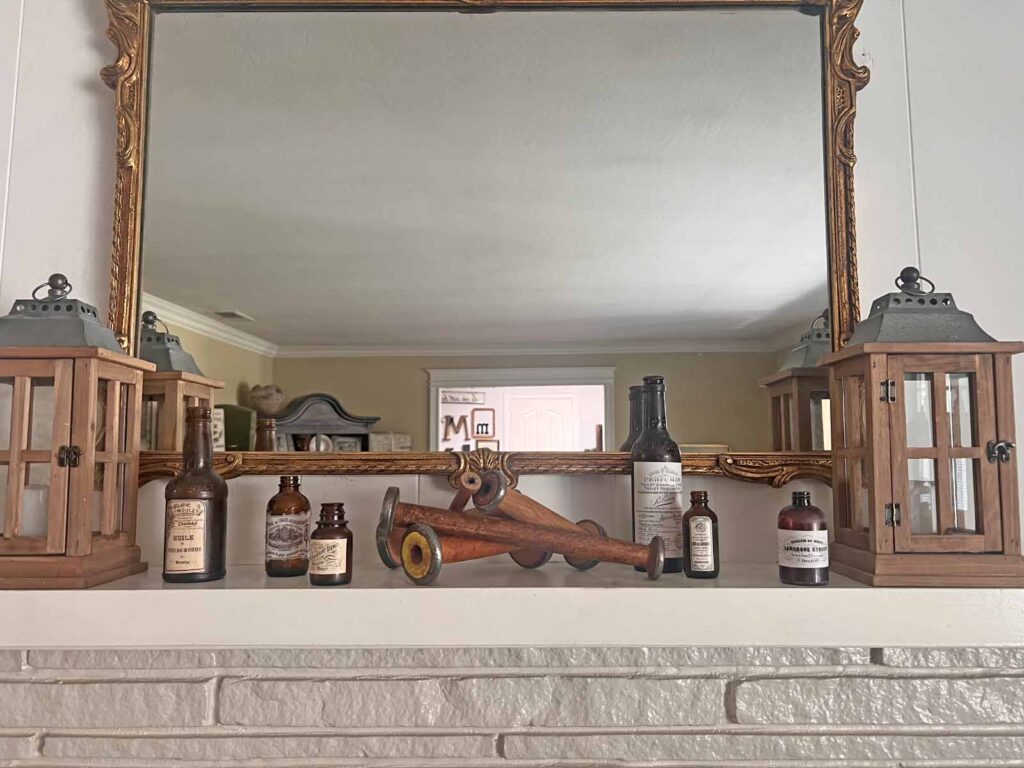Fall Mantel Decor: Embracing the Essence of Fall Slowly- spools with bottles