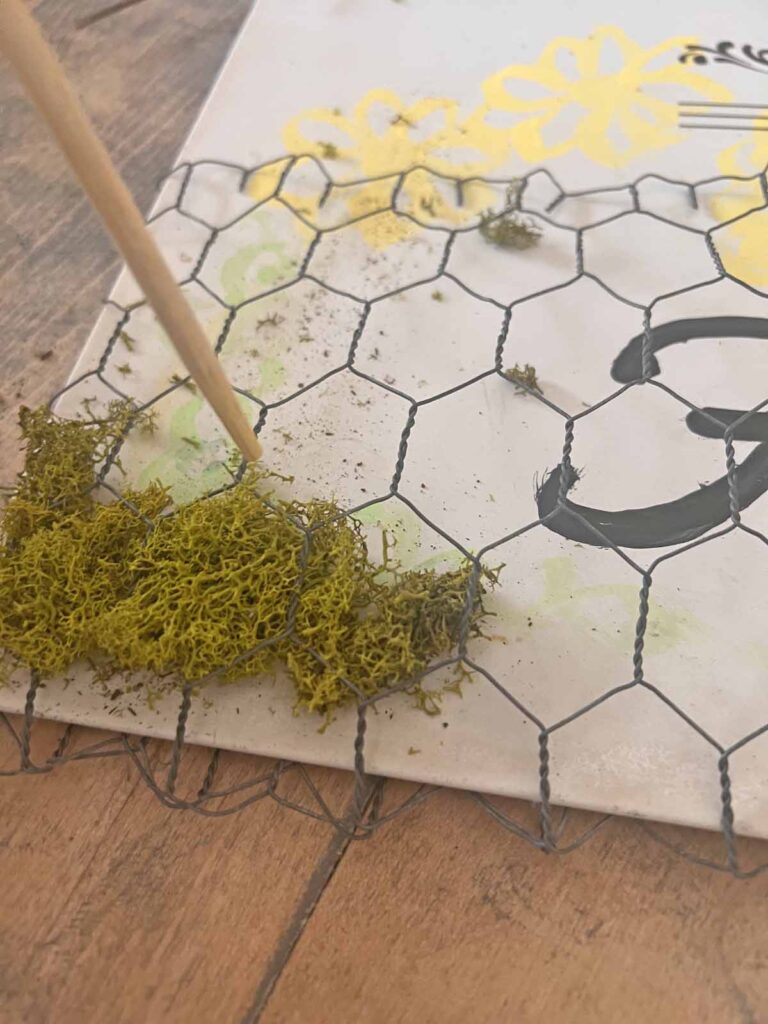 Floral garden metal sign glow-up adding moss