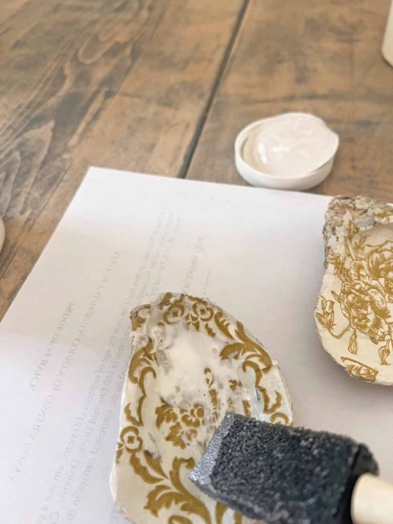 Summer craft: How to decoupage oyster shells into trend forward trinket dishes - applying Mod Podge top coat