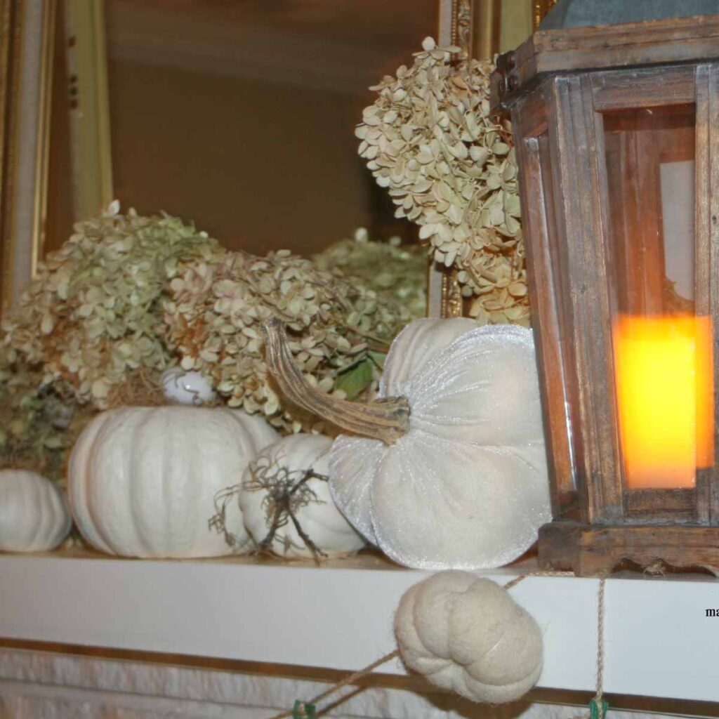 white pumpkin themed fall mantel styling with hydrangeas