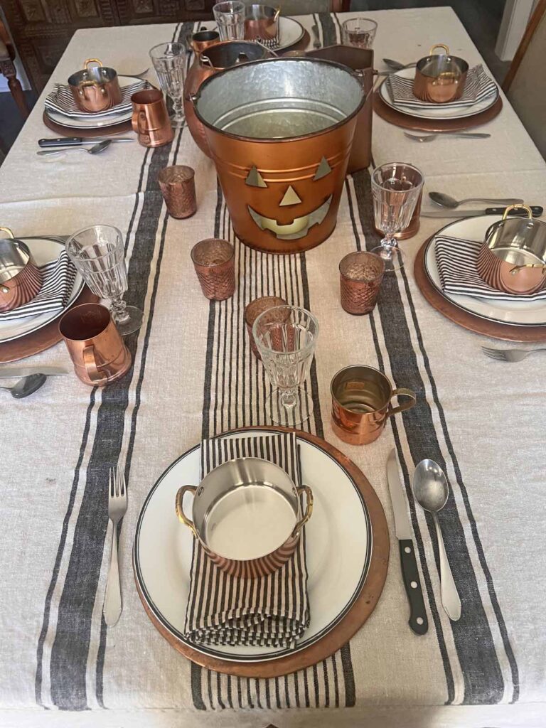 Halloween copper inspired table setting full table longwise