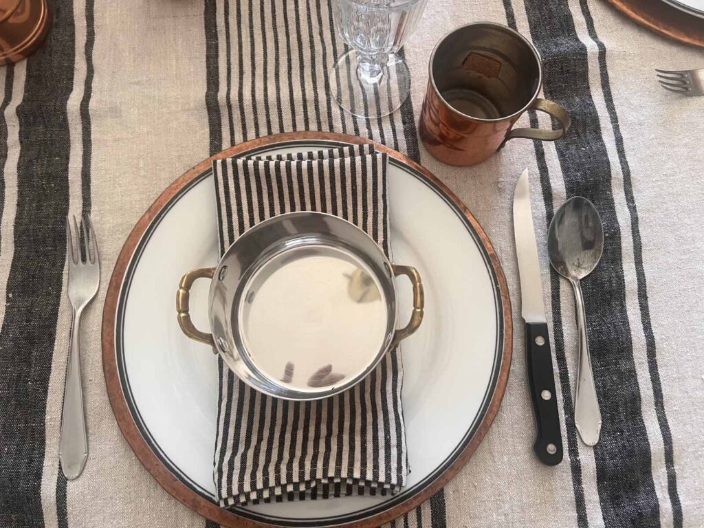 Halloween copper inspired table setting plate stack overhead