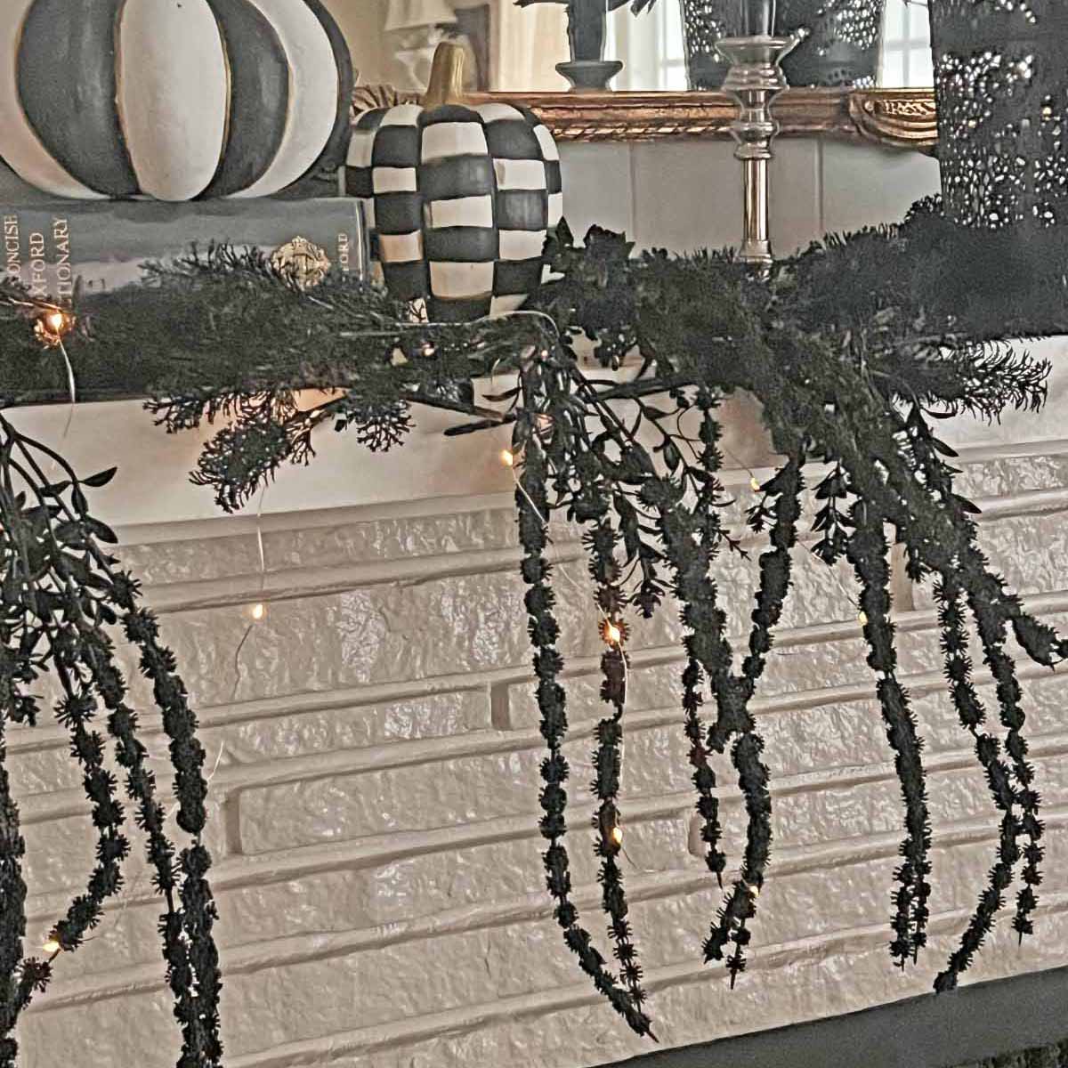 Another Anthropologie Dupe: Cascading black boughs Halloween garland DIY
