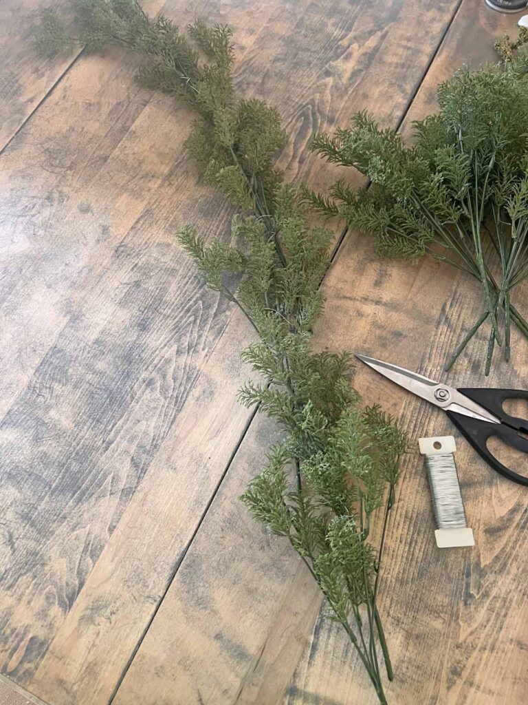Another Anthropologie Dupe: Cascading black boughs Halloween garland DIY creating greenery section