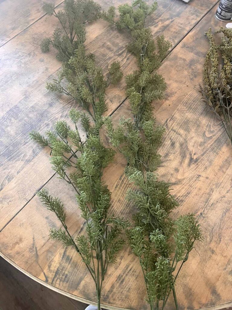 Another Anthropologie Dupe: Cascading black boughs Halloween garland DIY both greenery sections side by side