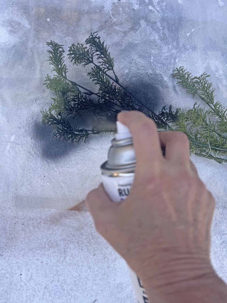 Another Anthropologie Dupe: Cascading black boughs Halloween garland DIY starting spray paint process