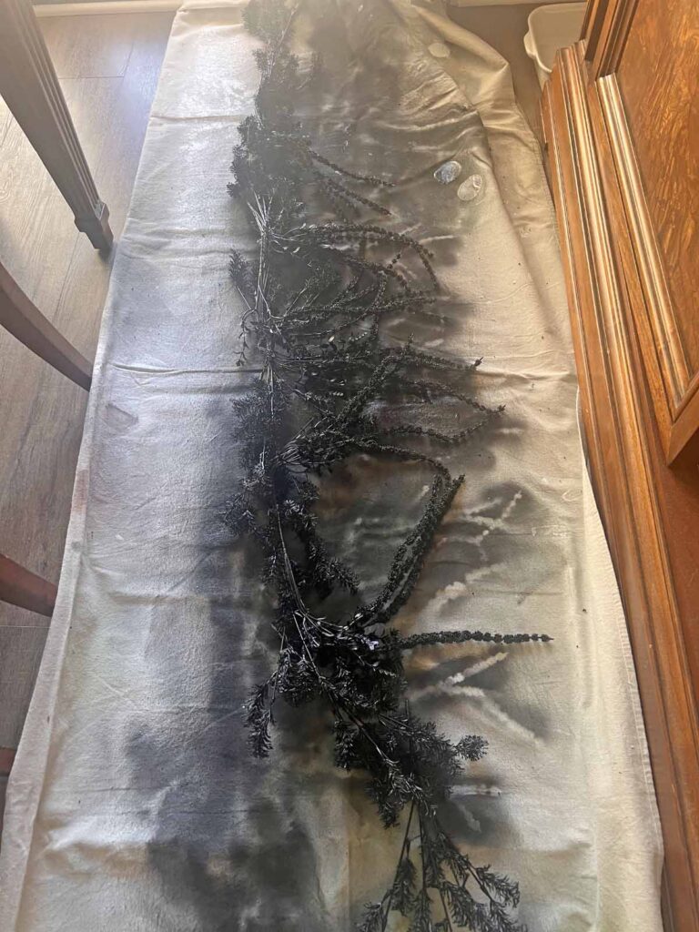 Another Anthropologie Dupe: Cascading black boughs Halloween garland DIY spray paint done