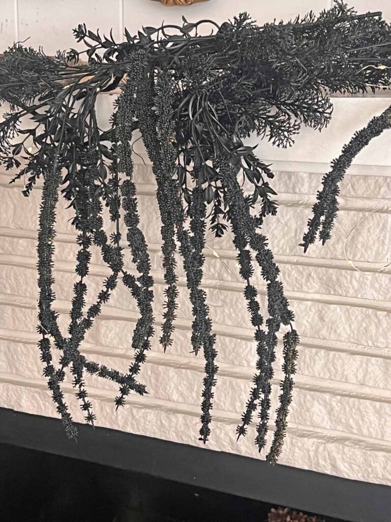 Another Anthropologie Dupe: Cascading black boughs Halloween garland DIY