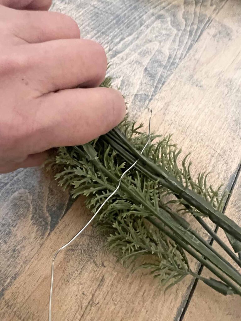 Another Anthropologie Dupe: Cascading black boughs Halloween garland DIY attaching greenery picks with wire