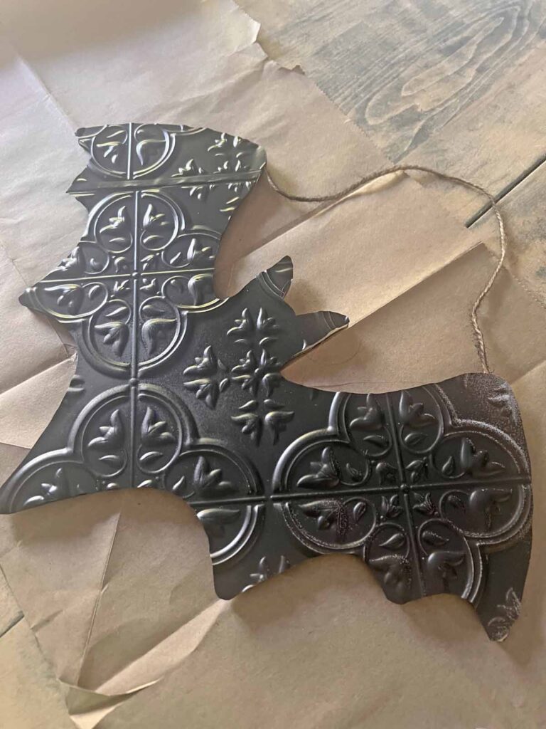 Halloween Decor: Faux tin tile bat DIY tin tile glued to wood bat