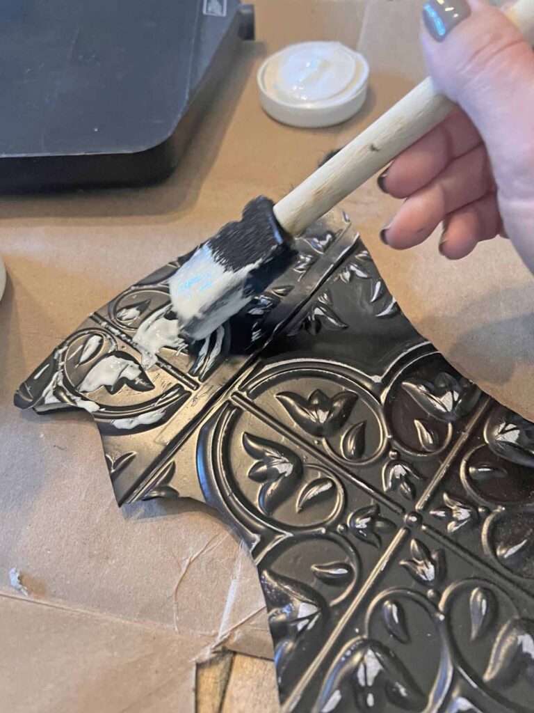 Halloween Decor: Faux tin tile bat DIY applying mod podge