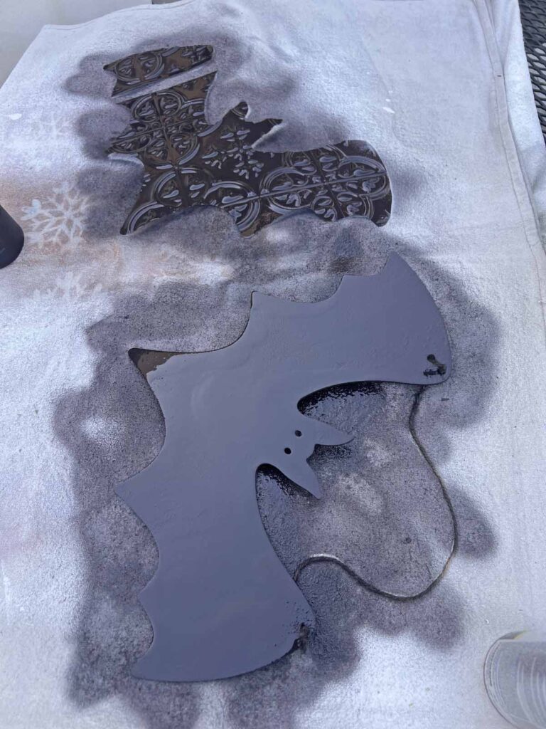 Halloween Decor: Faux tin tile bat DIY spray painted and drying