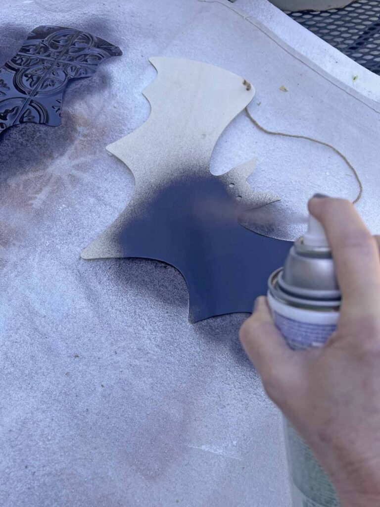 Halloween Decor: Faux tin tile bat DIY spray paining back of wood bat