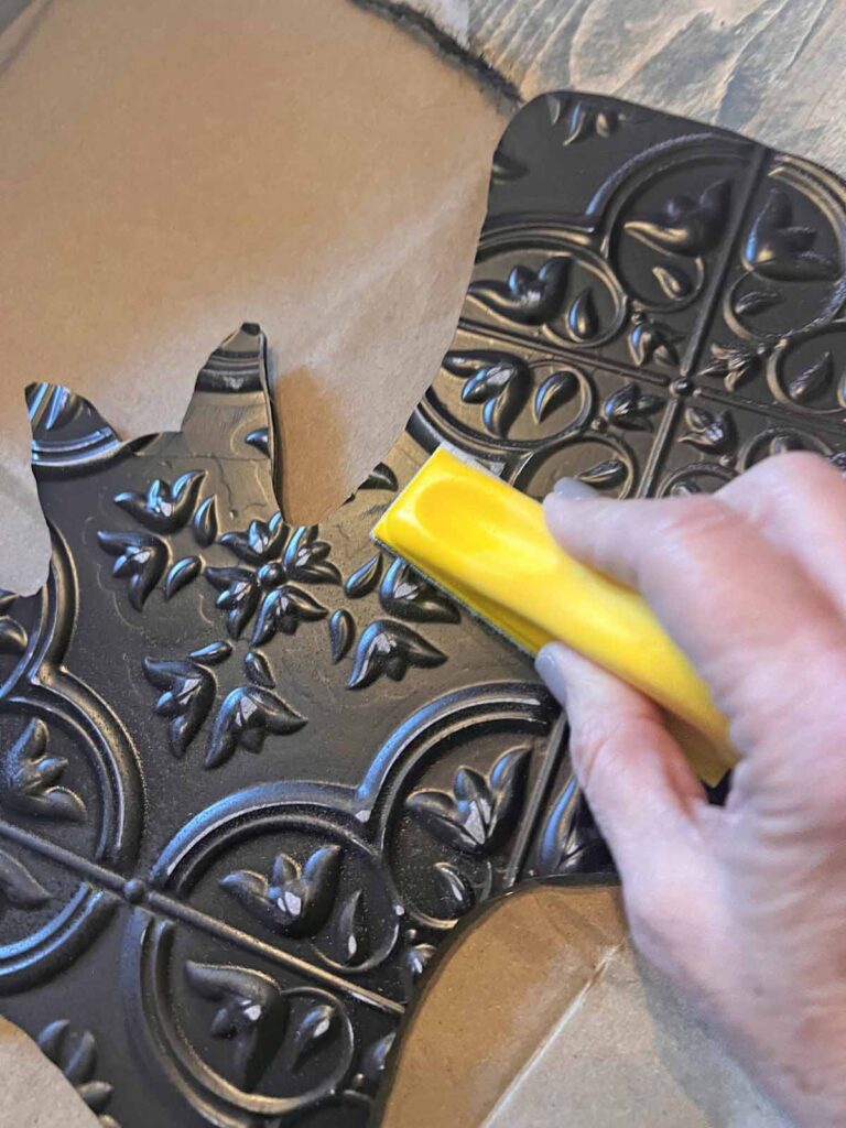 Halloween Decor: Faux tin tile bat DIY sanding relief on faux tin tile