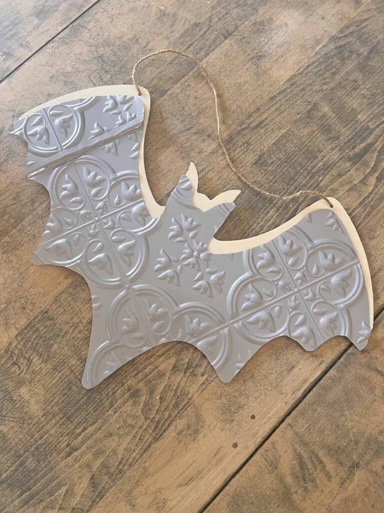 Halloween Decor: Faux tin tile bat DIY cut tin tile bat form on wood shape