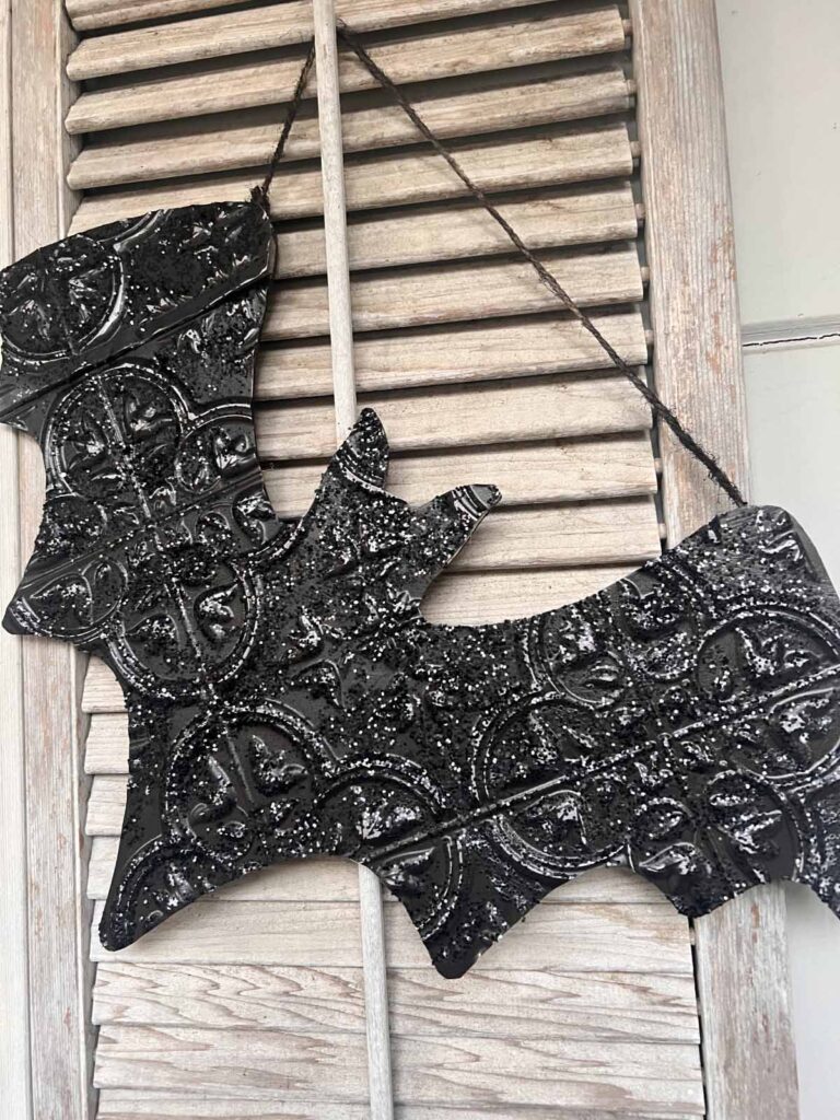Halloween Decor: Faux tin tile bat DIY hanging on shutters