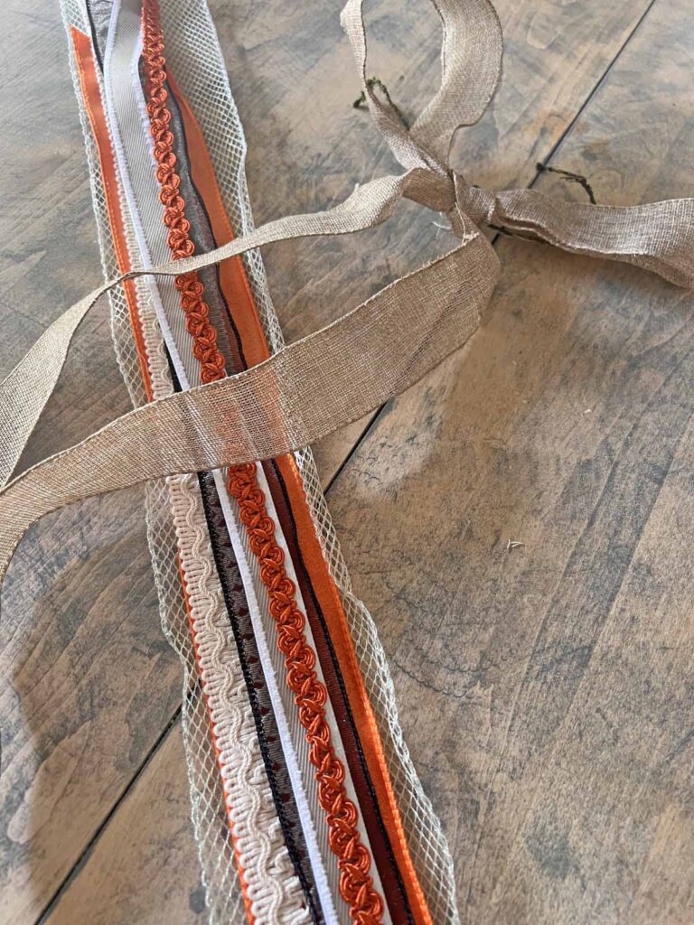 Seasonal Decor: Charming log tailed bow for a Classy Halloween accent long tailed ribbons selected and assembled