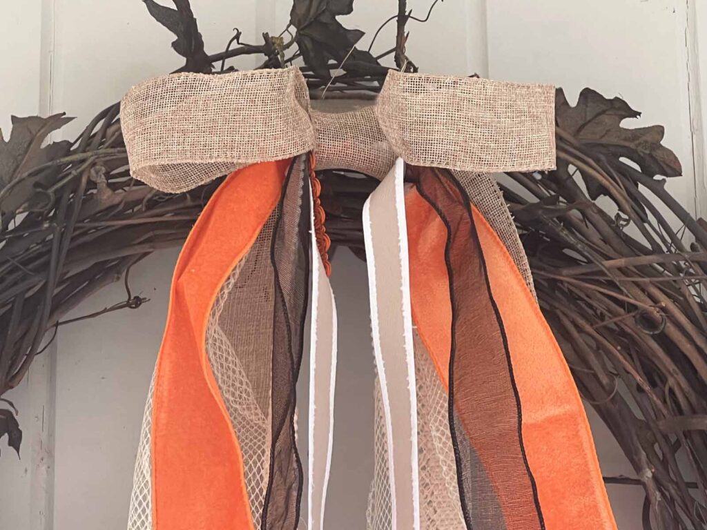 Seasonal Decor: Charming log tailed bow for a Classy Halloween accent book close-up
