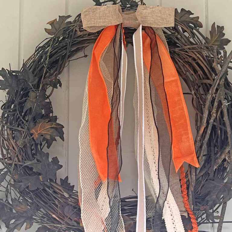 Seasonal Decor: Charming Long-tailed Bow for a Classy Halloween Accent