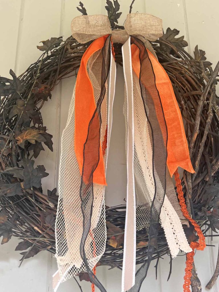 Seasonal Decor: Charming log tailed bow for a Classy Halloween accent tight close-up