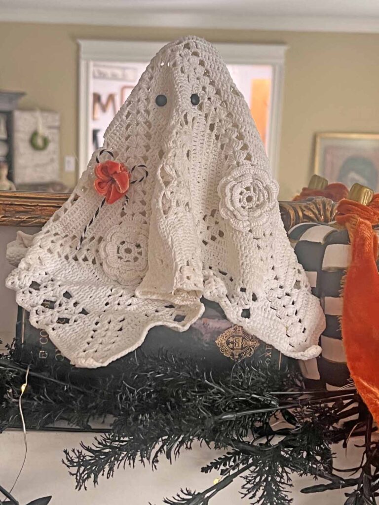 How to transform a thrifted Doily into Casper the friendly ghost for Halloween DIY on mantel shelf horizontal