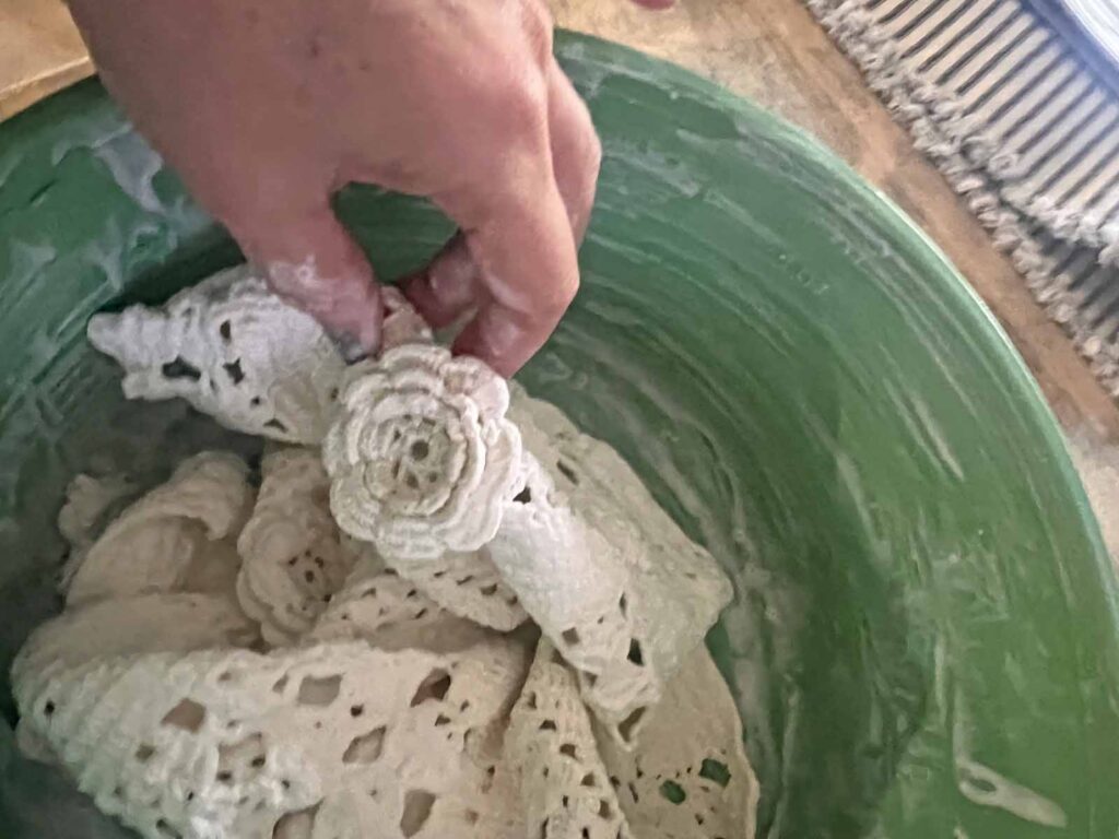 How to transform a thrifted Doily into Casper the friendly ghost for Halloween DIY doily saturated in mixture