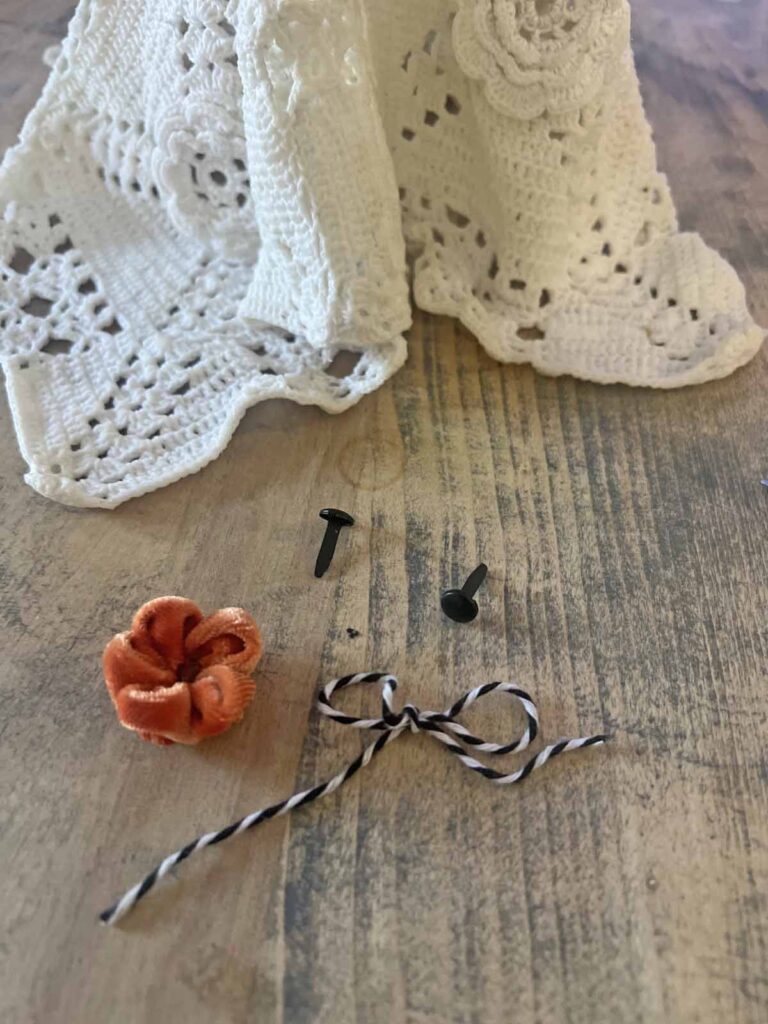 How to transform a thrifted Doily into Casper the friendly ghost for Halloween DIY selected embellishments