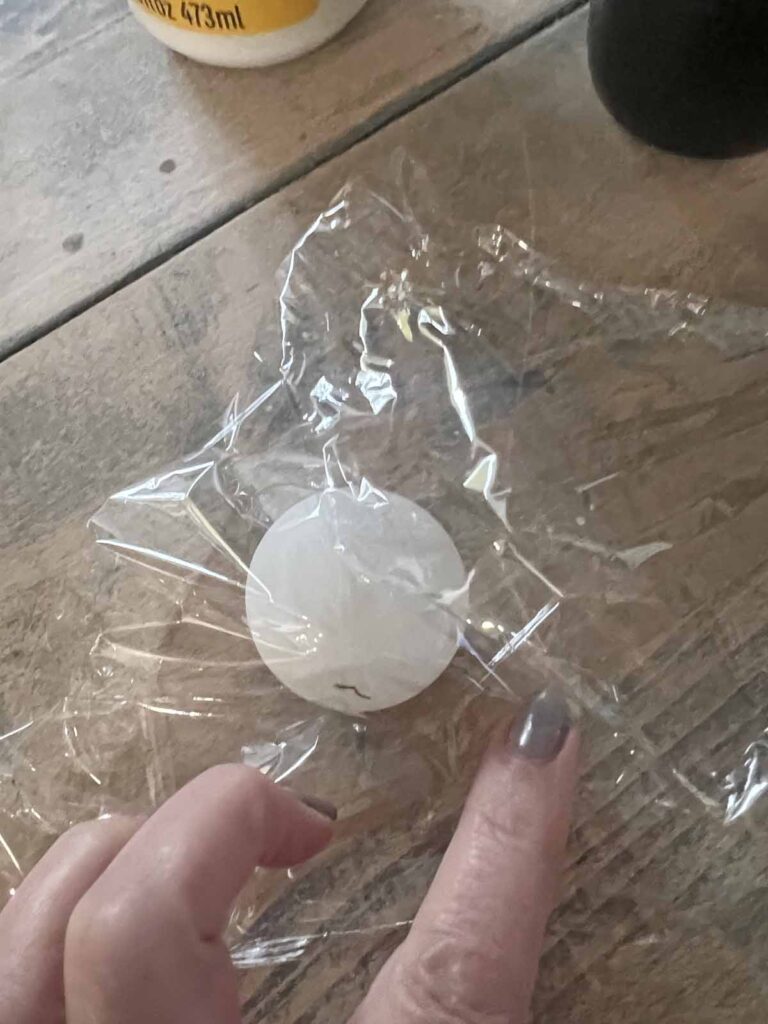 How to transform a thrifted Doily into Casper the friendly ghost for Halloween DIY wrapping ping pong ball in Saran Wrap